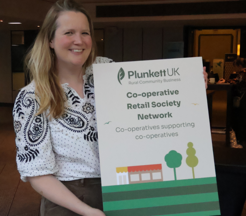 Hannah with Co-op sign