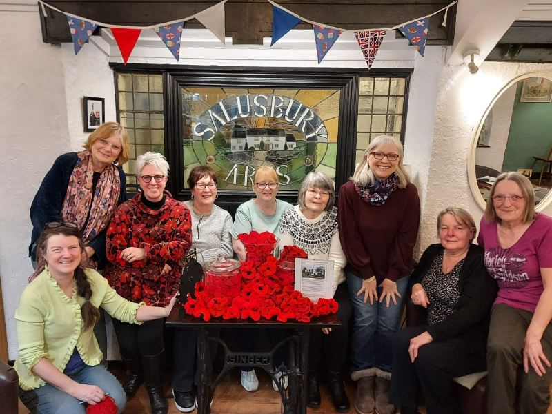 Volunteers at the poppy stand