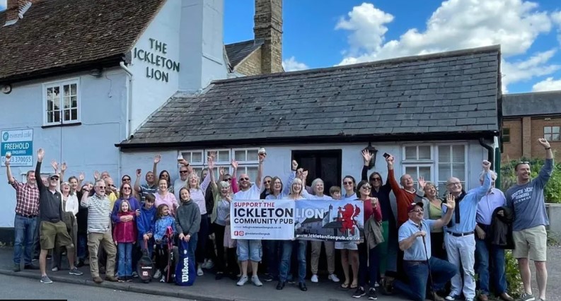 Volunteers outside community-owned pub